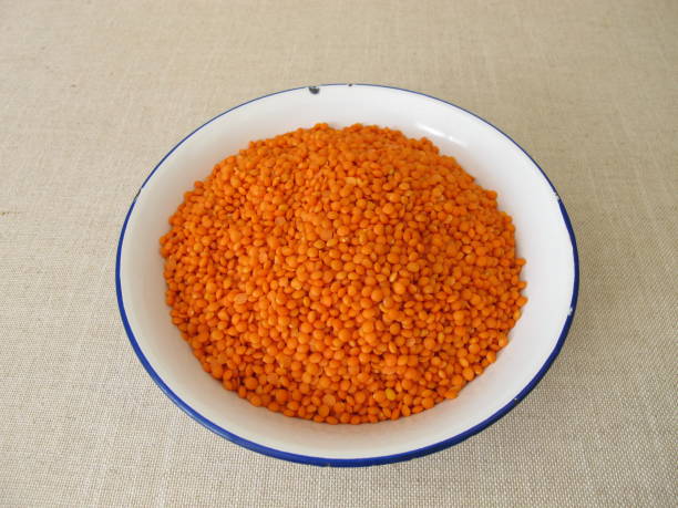 istock Hand bath with red lentils in a bowl 1314297985