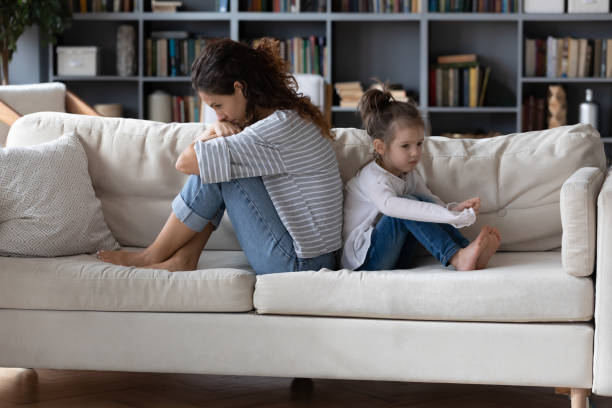 istock Unhappy mom and little daughter avoid talking after fight 1314299043
