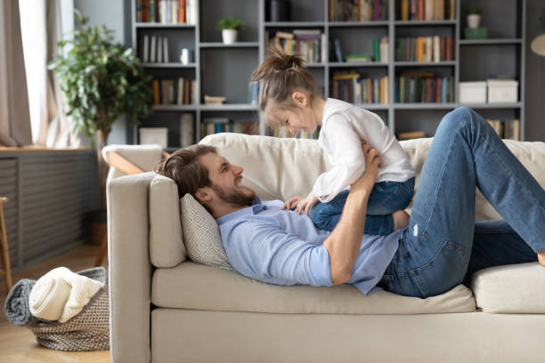 istock Happy father relax at home playing with small daughter 1314299076