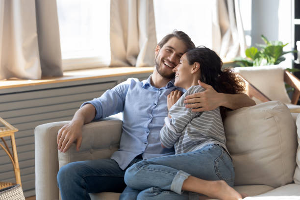 istock Happy millennial couple have fun relaxing at home 1314299113