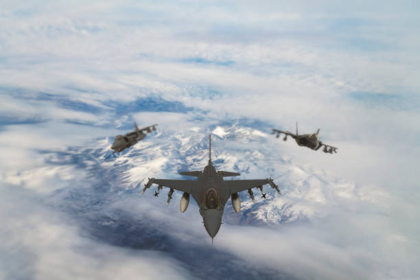 istock Fighting  jet airplanes flying over the clouds. 1314299160