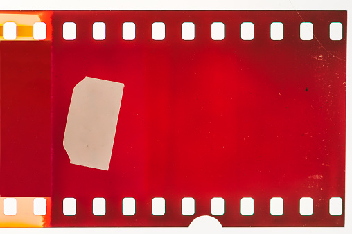 Vintage photo of movie clapper on wooden background, close up, top view, copy space