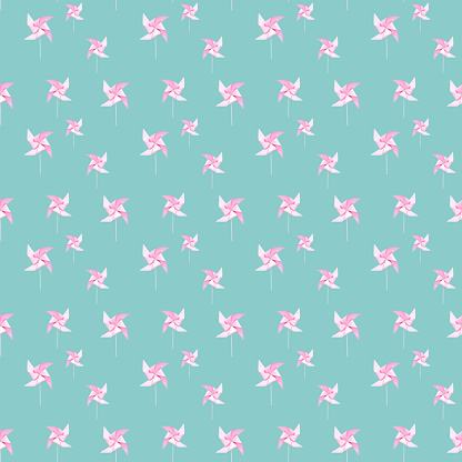 Pink paper windmills on turquoise background seamless pattern