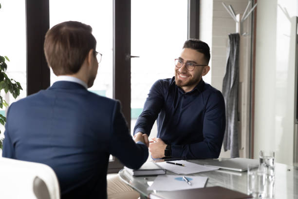 istock Rear view candidate shaking smiling Arabian hr manager hand 1314304067