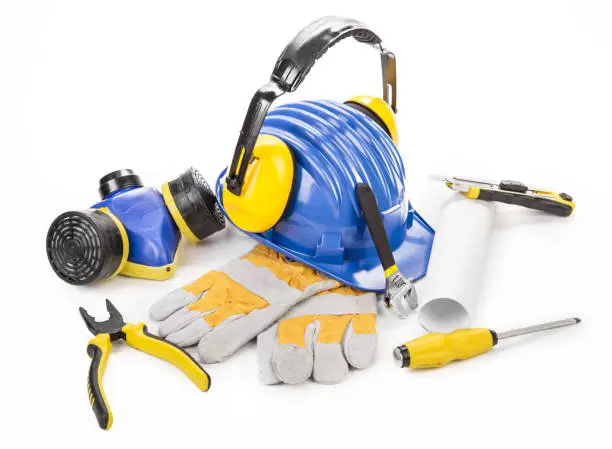 Protective equipment and work tools. Isolated over white background. Close-up.