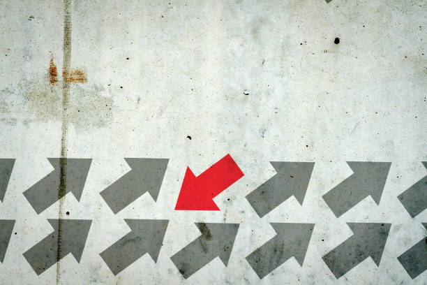 istock Arrows on a concrete wall. Red arrow, right direction. Leadership concept. Team. Business. 1314304776