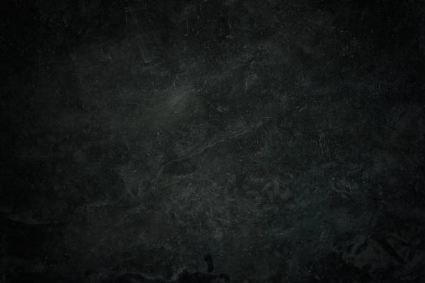 Art abstract wall, background or texture. Old black, dark gray rough floor or grunge wall cement texture use for text background. Black, dark gray retro stone Concrete wall surface in the grungy style.
