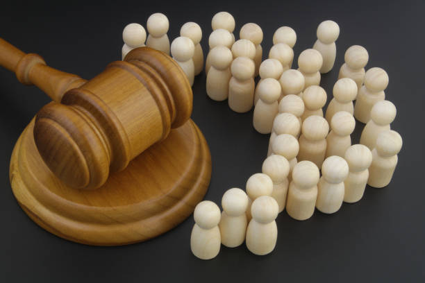 Crowd of people and judge gavel. stock photo