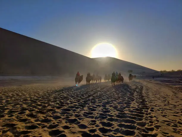 A group of local merchants starts the commercial pilgrimage on the Silk Road, in the outskirts of Dunhuang in China