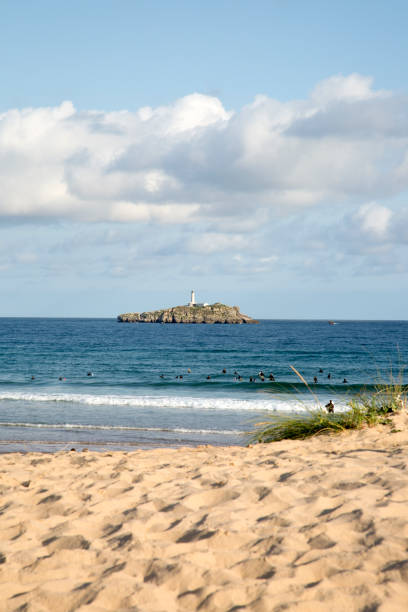 istock Somo Beach with Mouro Island and Lighthouse; Santander 1314314832