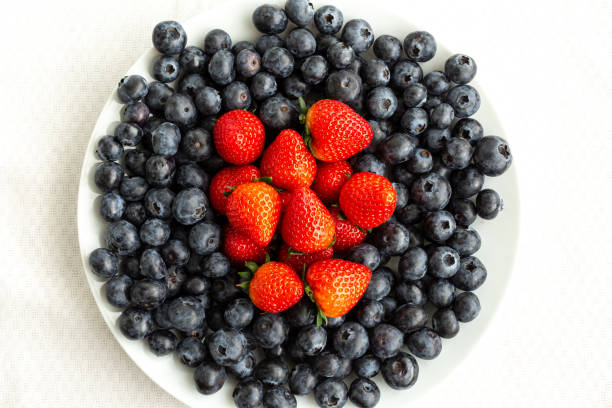 istock full plate of blueberries and strawberries top view 1314315280