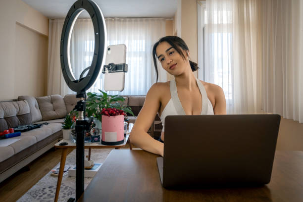 istock Young vlogger woman broadcasts live at home. 1314316198