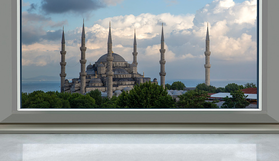front view, empty window sill in front of the background of the sultan ahmed mosque (Blue Mosque) in the holy month of ramadan. Mosque visible through the window