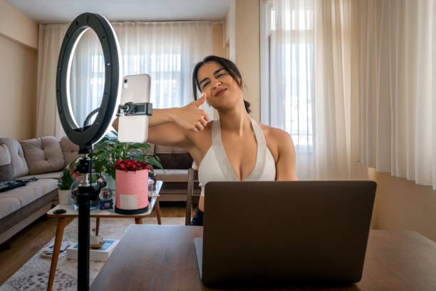 istock Young vlogger woman broadcasts live at home. 1314322186