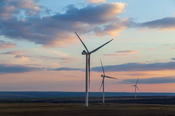 istock Energy. Wind turbines at dusk at sunset 1314323672