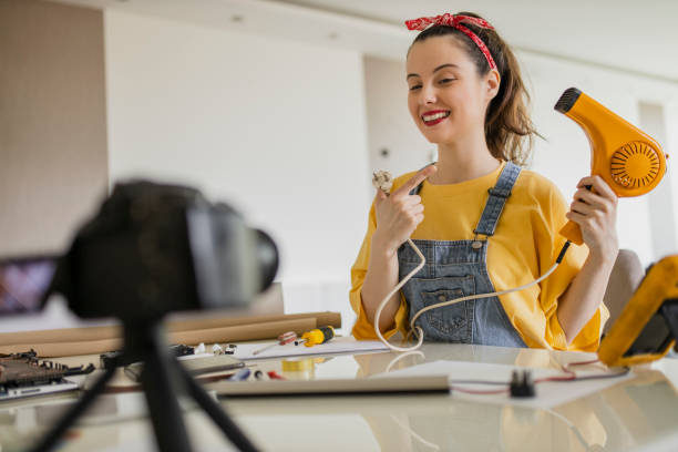 istock Social media technology influencer recording video tutorial about retro hair dryer 1314324473