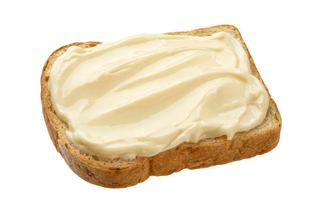 istock Slice of bread with cream cheese isolated on white background, top view 1314324764