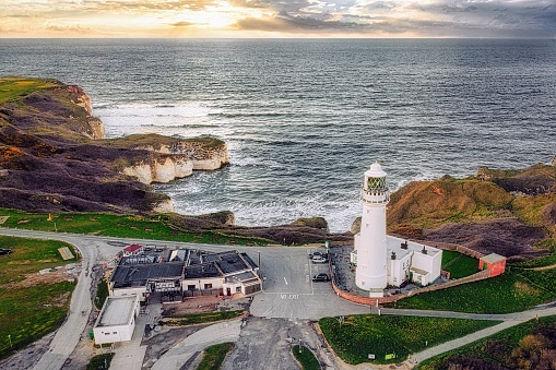 Flamborough Head Lighthouse is an active lighthouse located at Flamborough, East Riding of Yorkshire. England. Flamborough Head Lighthouse acts as a waypoint for passing deep sea vessels and coastal traffic, and marks Flamborough Head for vessels heading towards Scarborough and Bridlington.
