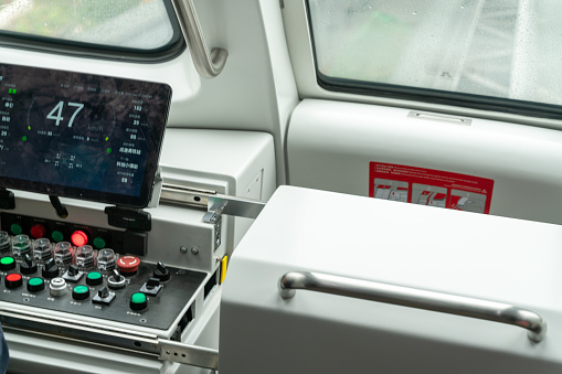 Chongqing,China-April 17 2021: Chinese newly made self-driving unmanned light rail named as skyshuttle operated for the first time with advanced BYD battery power technology. The interior of auto control cabin.
