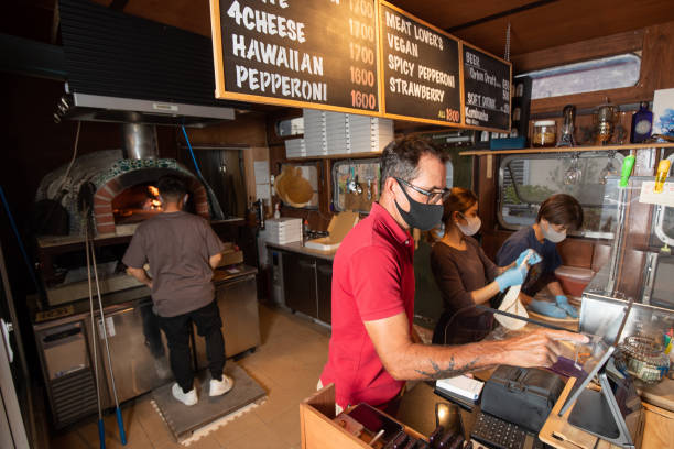 istock Busy small family pizza business 1314326546