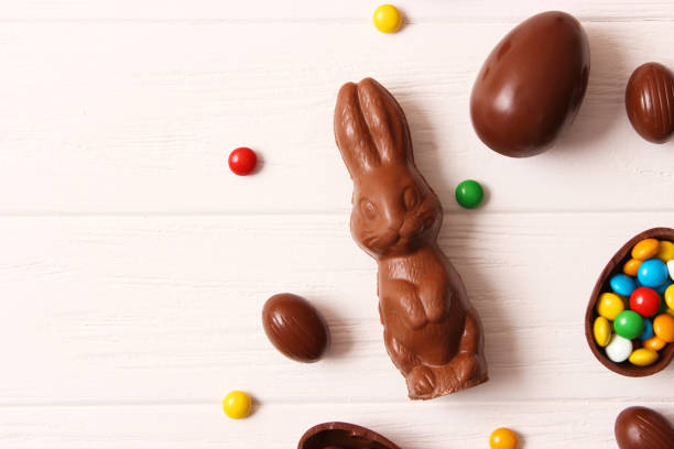 istock Easter composition with chocolate eggs and chocolate rabbit on wooden background 1314326580