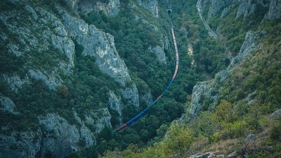 Train passing through the Sicevo Gorge on a summer day