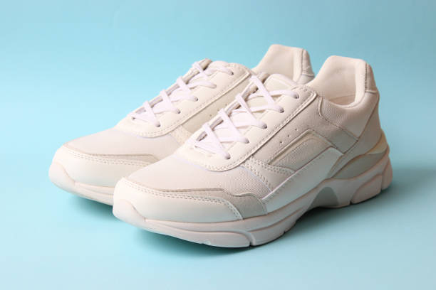 istock women's sneakers on a colored background top view. Women's shoes. 1314327042