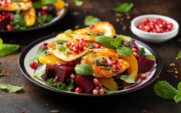 istock Fried Halloumi Cheese salad with beetroot, orange, pomegranate and pumpkin seeds, red onion, green vegetables. healthy food 1314328135