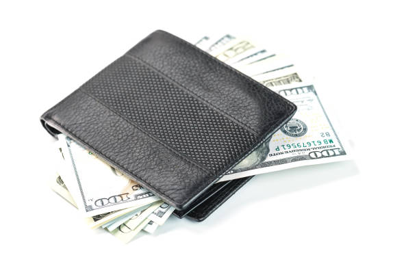 istock Black wallet with genuine leather dollars on an isolated white background. 1314330234