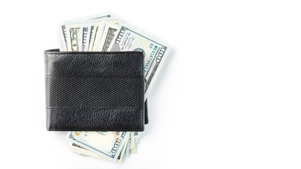 istock Black wallet with genuine leather dollars on an isolated white background. 1314331092