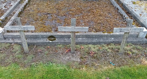 Three blank old wooden crosses in St Fechins Church of Ireland graveyard in Termonfeckin Village, Ireland.