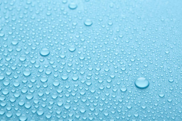 istock Pure water drops on blue abstract background or texture. 1314332184