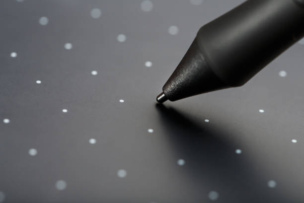 istock Pen and graphic tablet close-up on a gray textural background. Gadget for working as a designer, artist and photographer. 1314333417