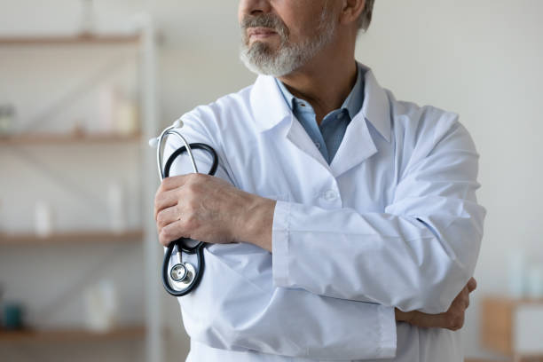 istock Old middle aged cardiologist therapist physician close up view. 1314334400