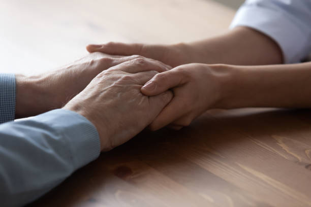 istock Kind young female doctor supporting old man. 1314334472