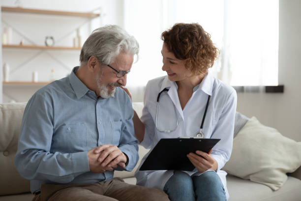 happy doctor sharing good test results news with old patient. - médico geral imagens e fotografias de stock