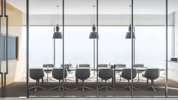 Side view shot of a modern luxurious conference room with equipments, table and chairs at sunny day with city view.