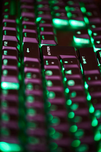 istock Parts of an illuminated computer keyboard in the dark. 1314335975