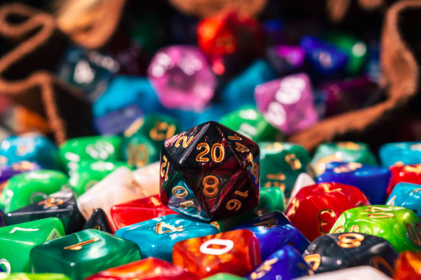 Close-up of a d20 on a pile of dice stock photo