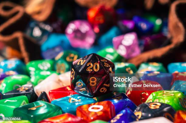 Closeup Of A D20 On A Pile Of Dice Stock Photo - Download Image Now - Dice, Fantasy, Table