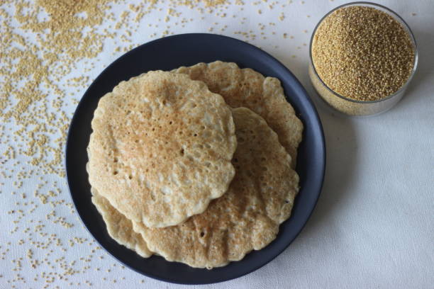 istock Rice pancakes made with foxtail millets flour. An experimental version of a popular Kerala dish called kallapam 1314337843