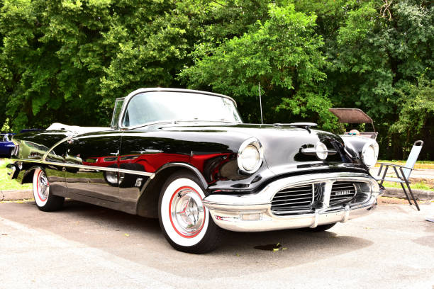 Mount Pleasant, Wisconsin / USA - July, 21, 2019: A beautiful straight black 1956 Oldsmobile 88 Convertible with the top down at the Quarry Lake Park Car Show in Wisconsin.