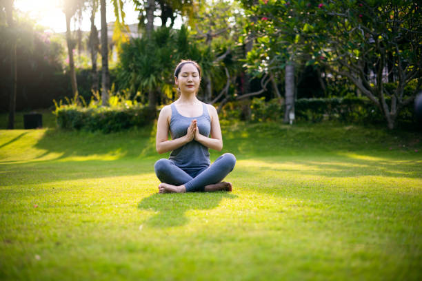 istock Practicing yoga and meditating in the nature 1314340279