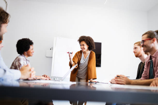 istock Successful company with happy workers. Business, meeting, office concept 1314340645