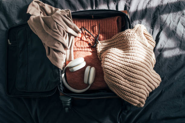 istock Still life:  Packing up Suitcase for Winter Holiday, an Overhead View (Flat Lay) 1314341941