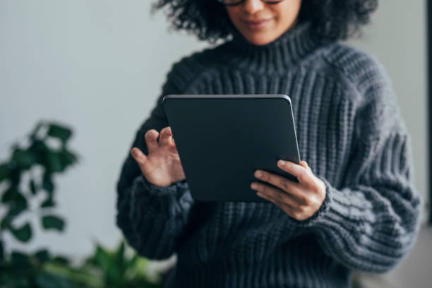 istock Working from Home: an Unrecognizable Young Woman Using a Digital Tablet to ReadWatch Something (Horizontal) 1314342010