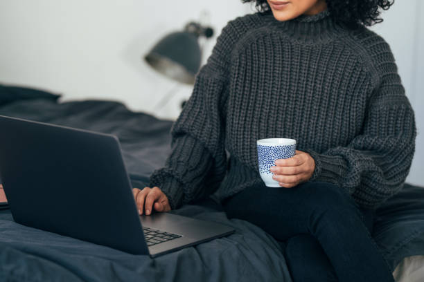 istock Working from Home: an Anonymous Young Woman Using her Laptop to Do Business (Horizontal) 1314342014