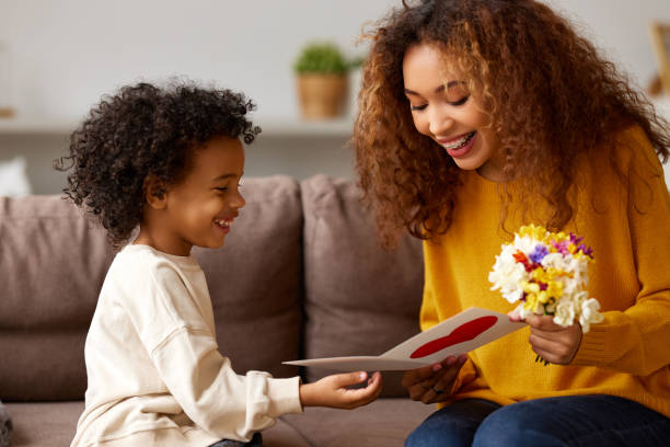 istock Young mixed race woman getting congratulations from son on Mothe 1314343686