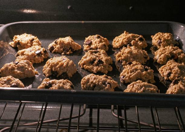 istock Oatmeal chocolate chip cookies popped into the oven ready for baking 1314343997