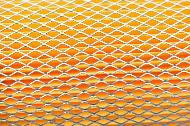 istock Orange car filter background with iron grille close-up 1314345118